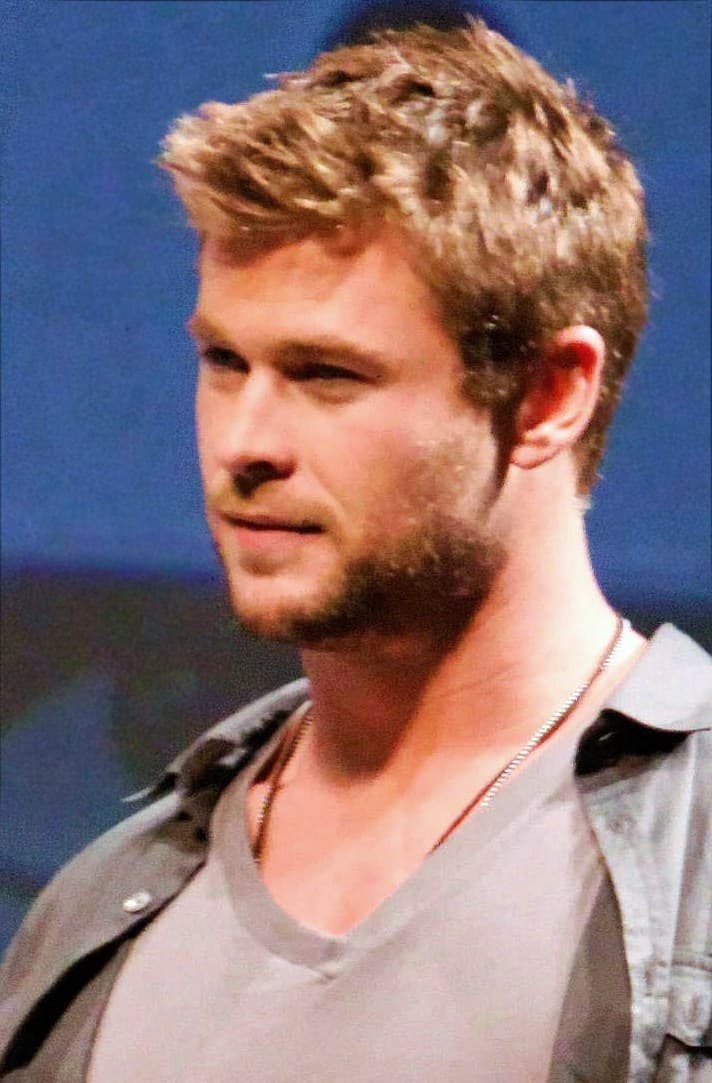 Classic cropped frontal — athletic face planes under earlier public lighting.