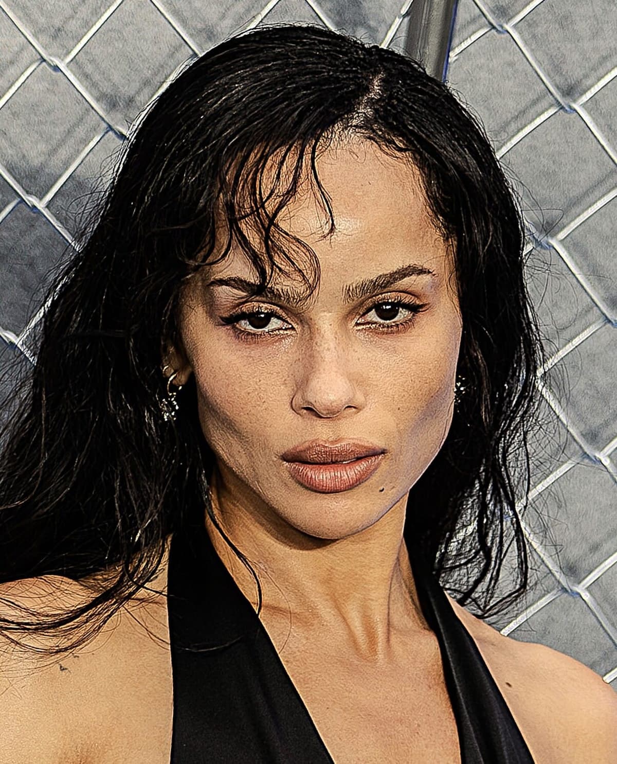 2025 premiere crop — soft-smile almond gaze under modern event flash.